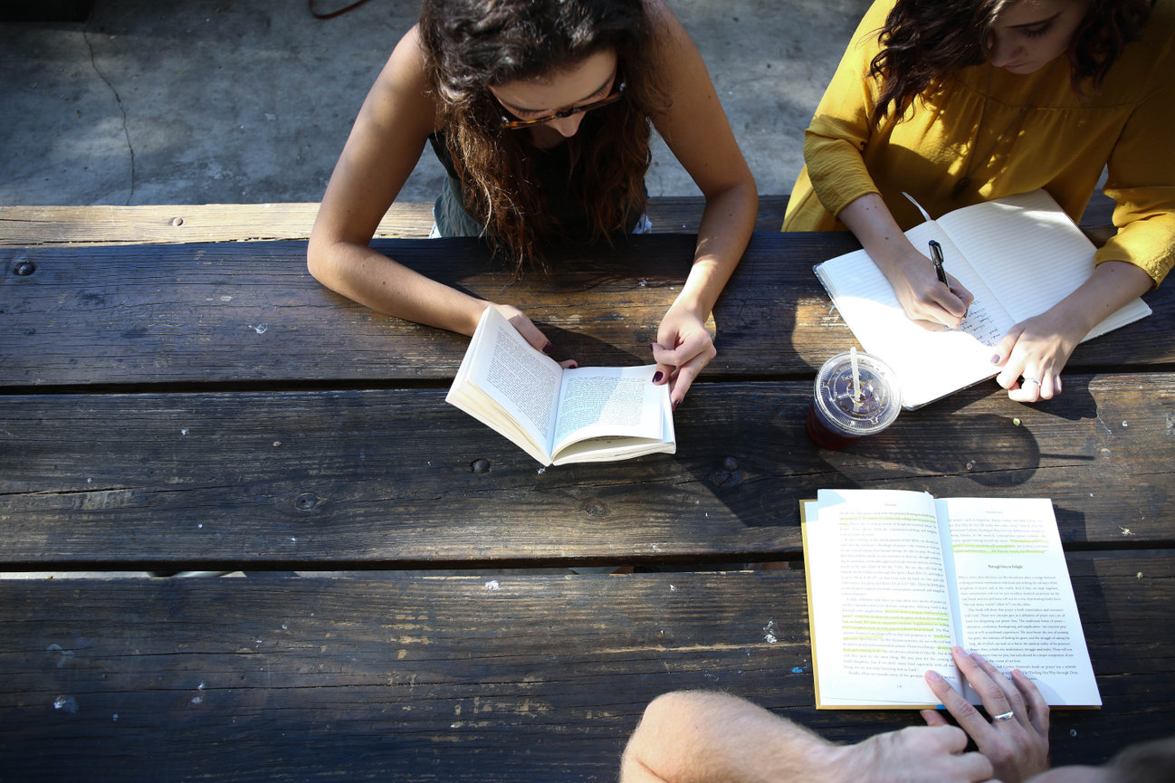 Girls Reading At Table